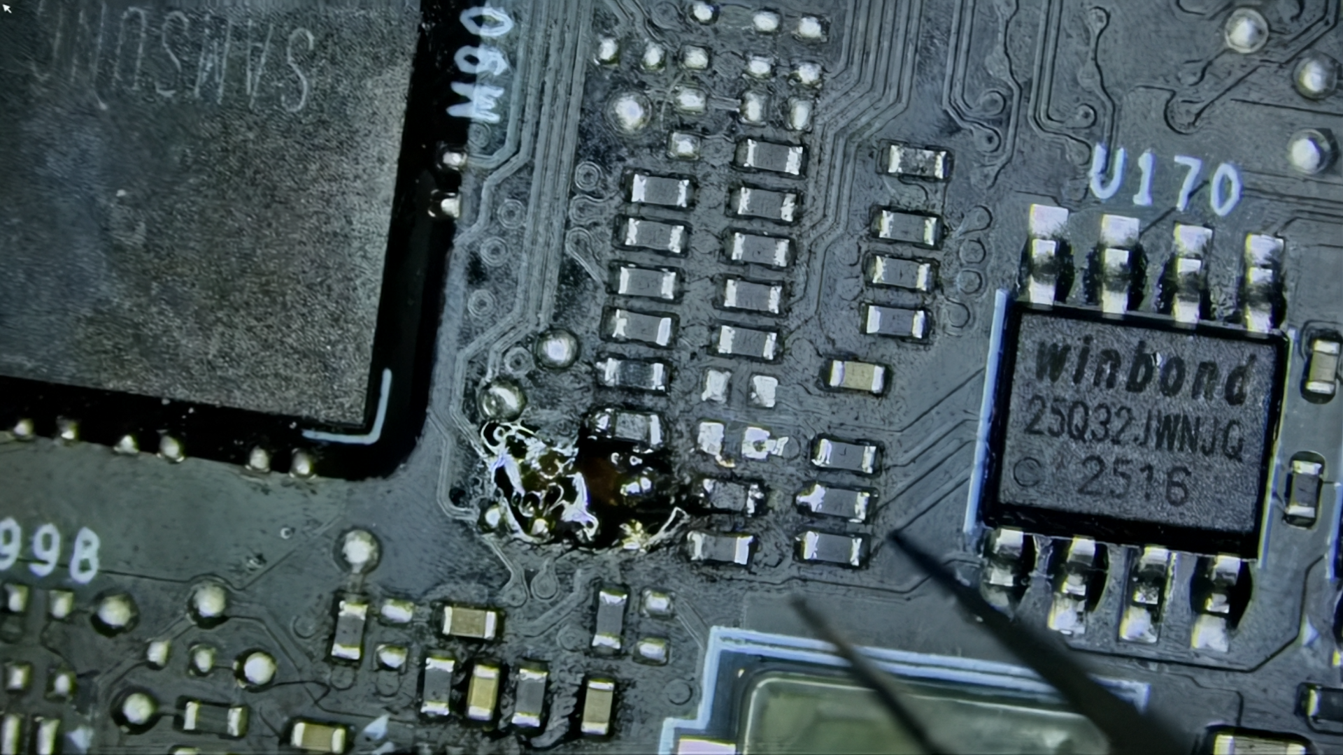 Close-up of damaged MSI RTX 5090 Lightning Z PCB with ripped soldering pad and misaligned resistors