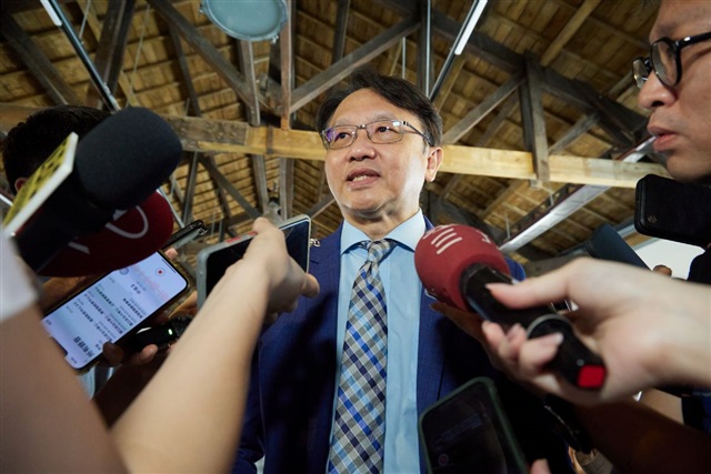 Acer chairman and CEO Jason Chen speaking at a press conference, with a blurred background of technology equipment.