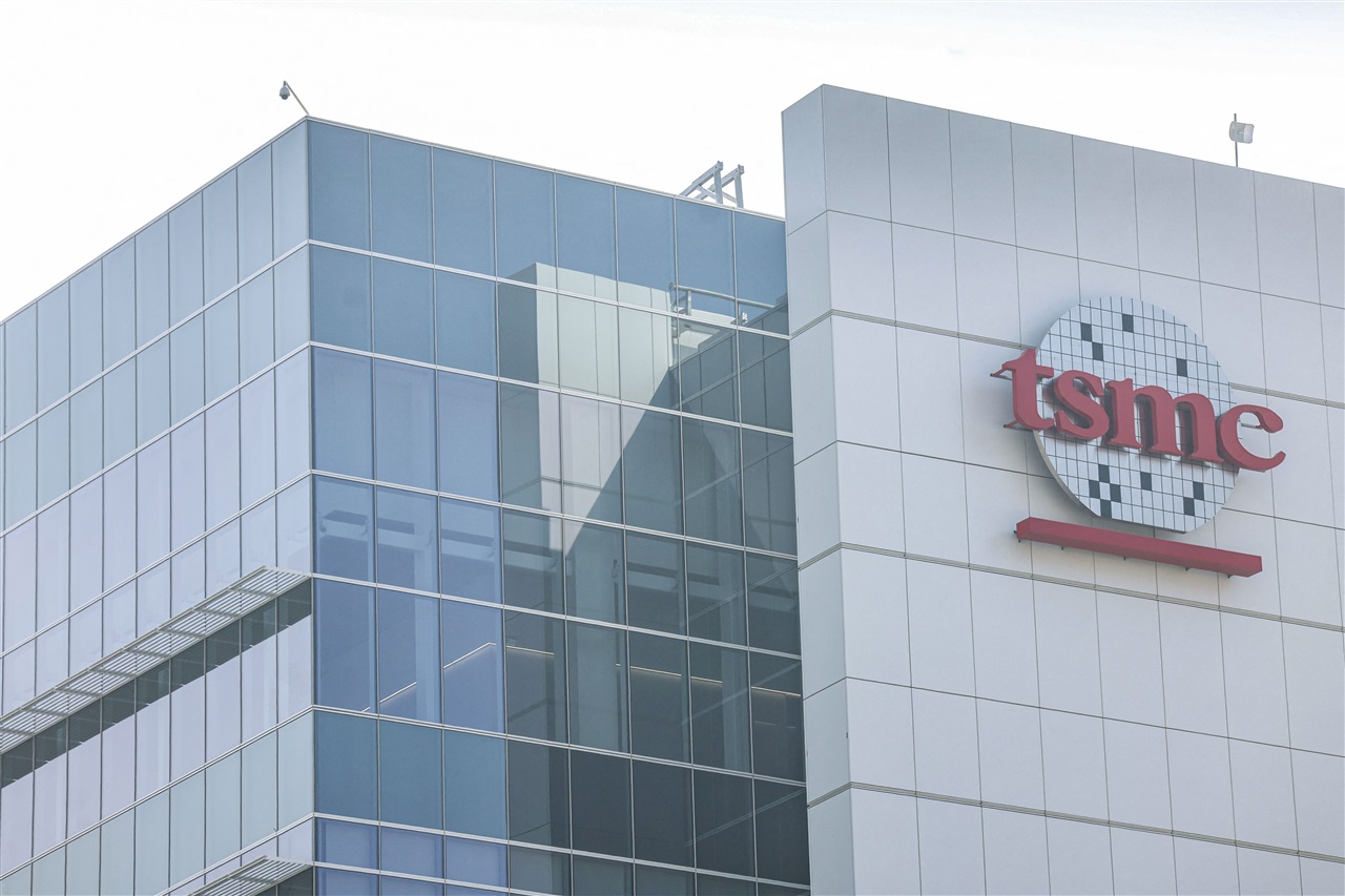 A TSMC fabrication plant with a sign indicating advanced semiconductor production.