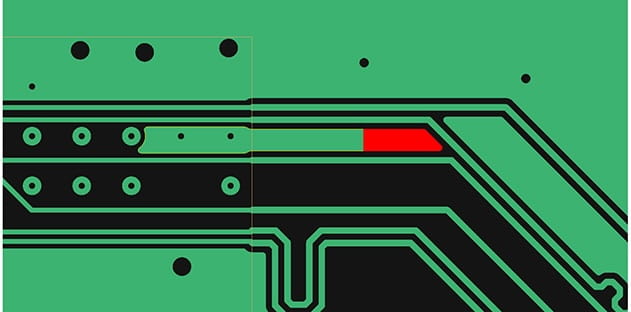 A close-up of a complex printed circuit board with complex copper traces.
