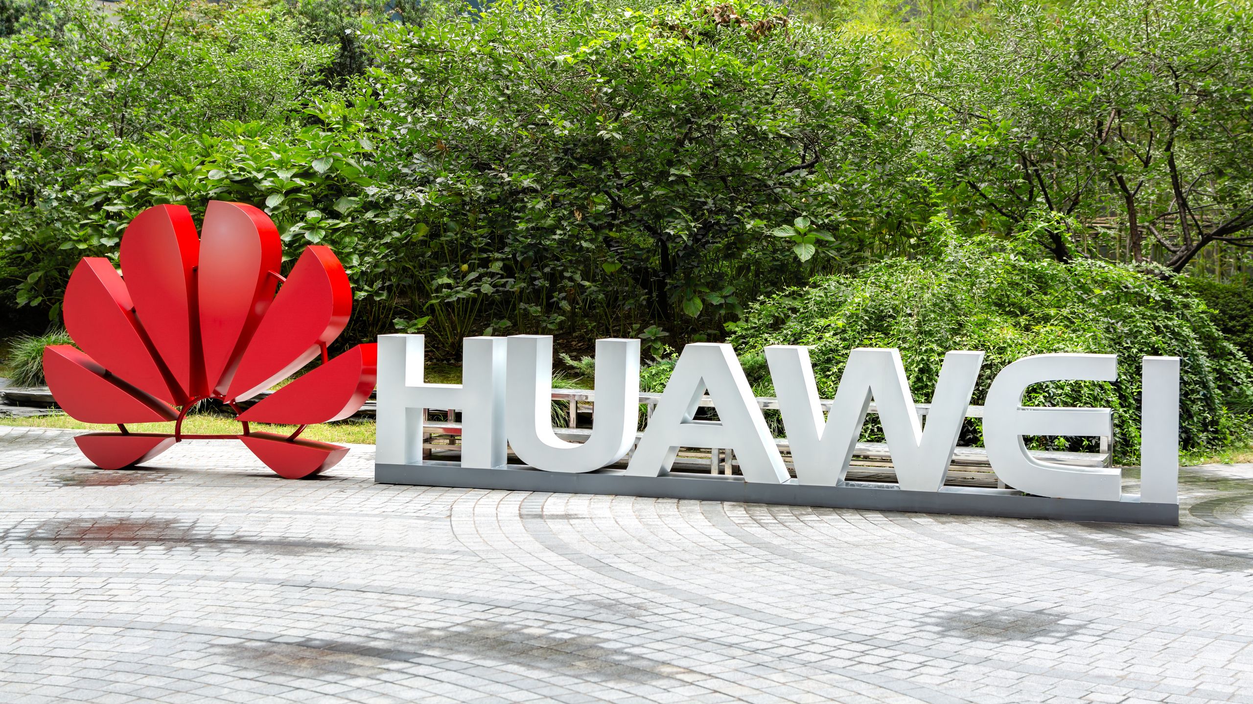 Close-up of a complex circuit board with many exposed silicon chips, representing Huawei's 122TB SSD's Die-on-Board packaging.