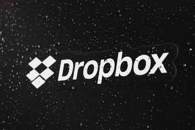 A graphic representing the Dropbox logo with subtle forward-pointing arrows indicating progress and change.