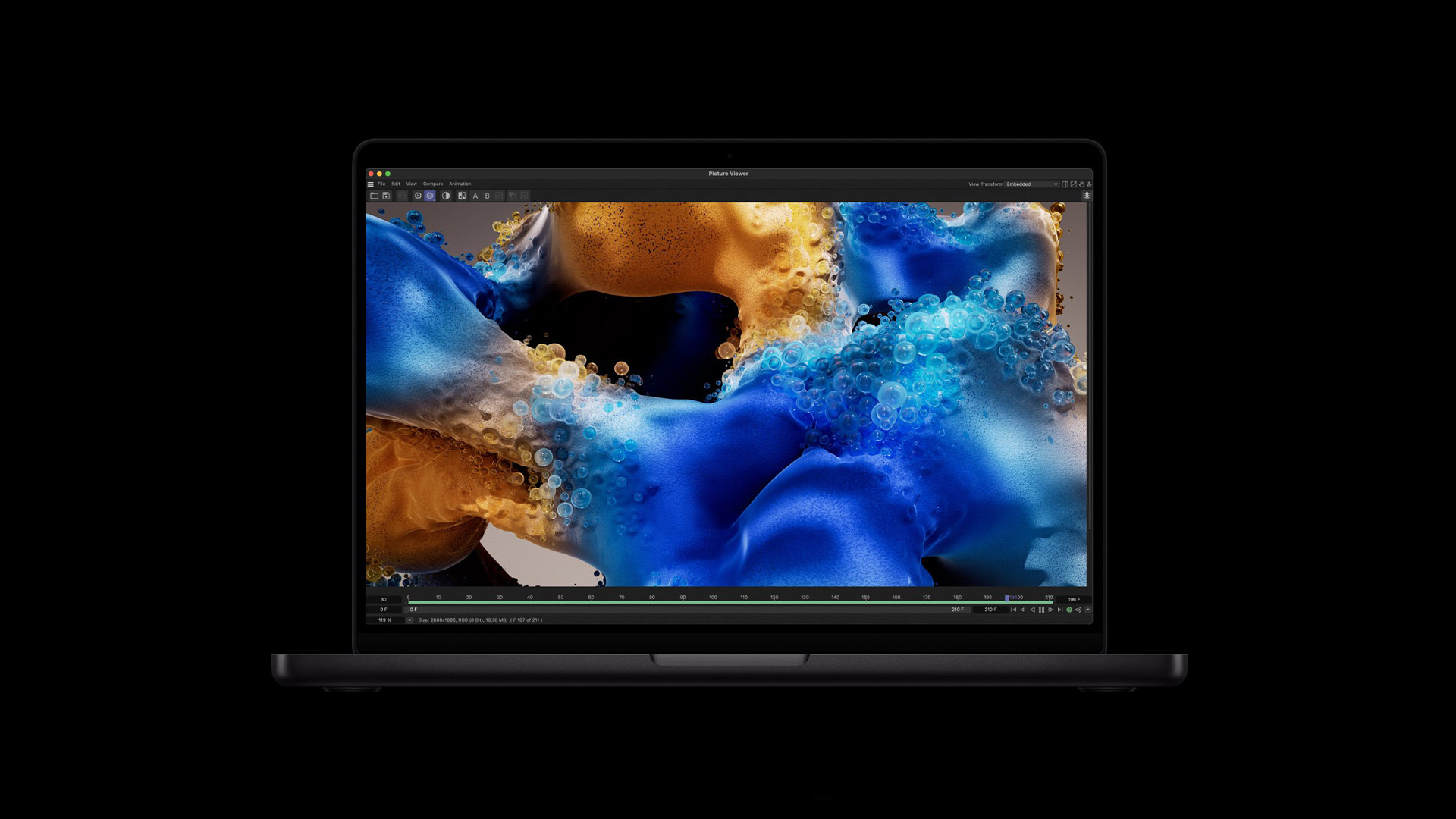 A comparison shot showing the slim profile of a Razer Blade 16 laptop next to a MacBook Pro.