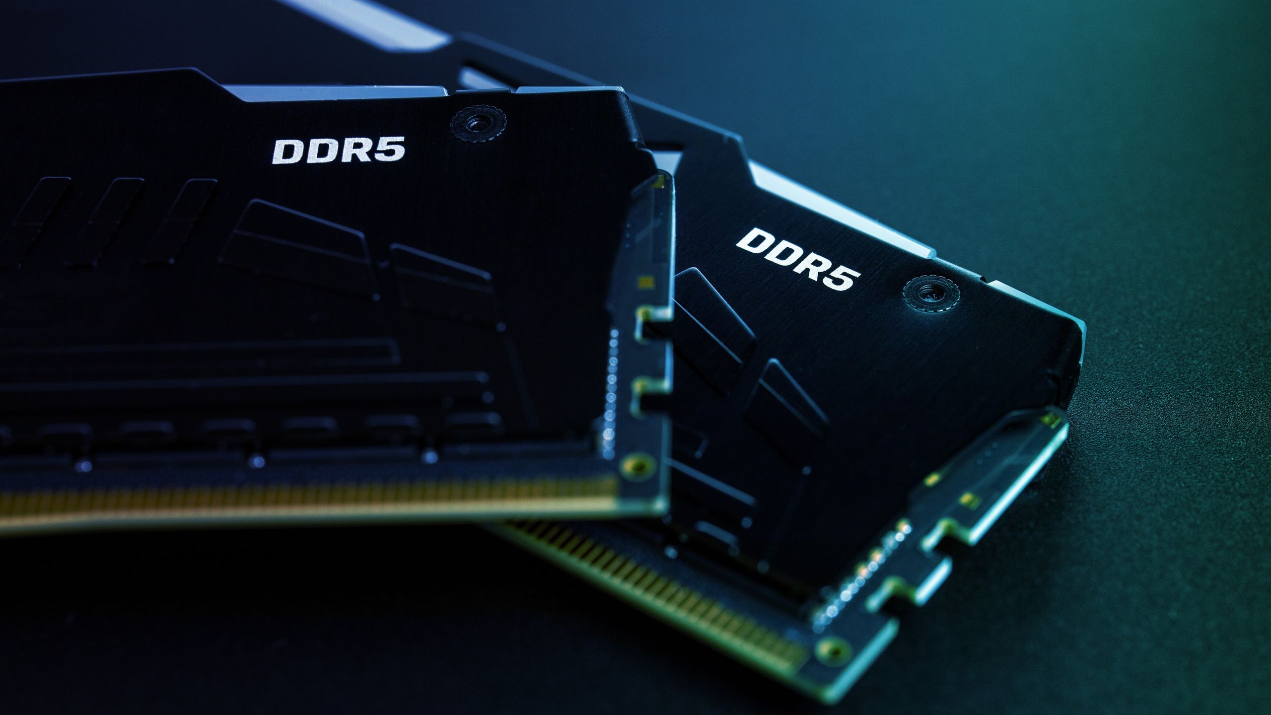 Close-up of an AMD Ryzen CPU package with visible pins and branding.