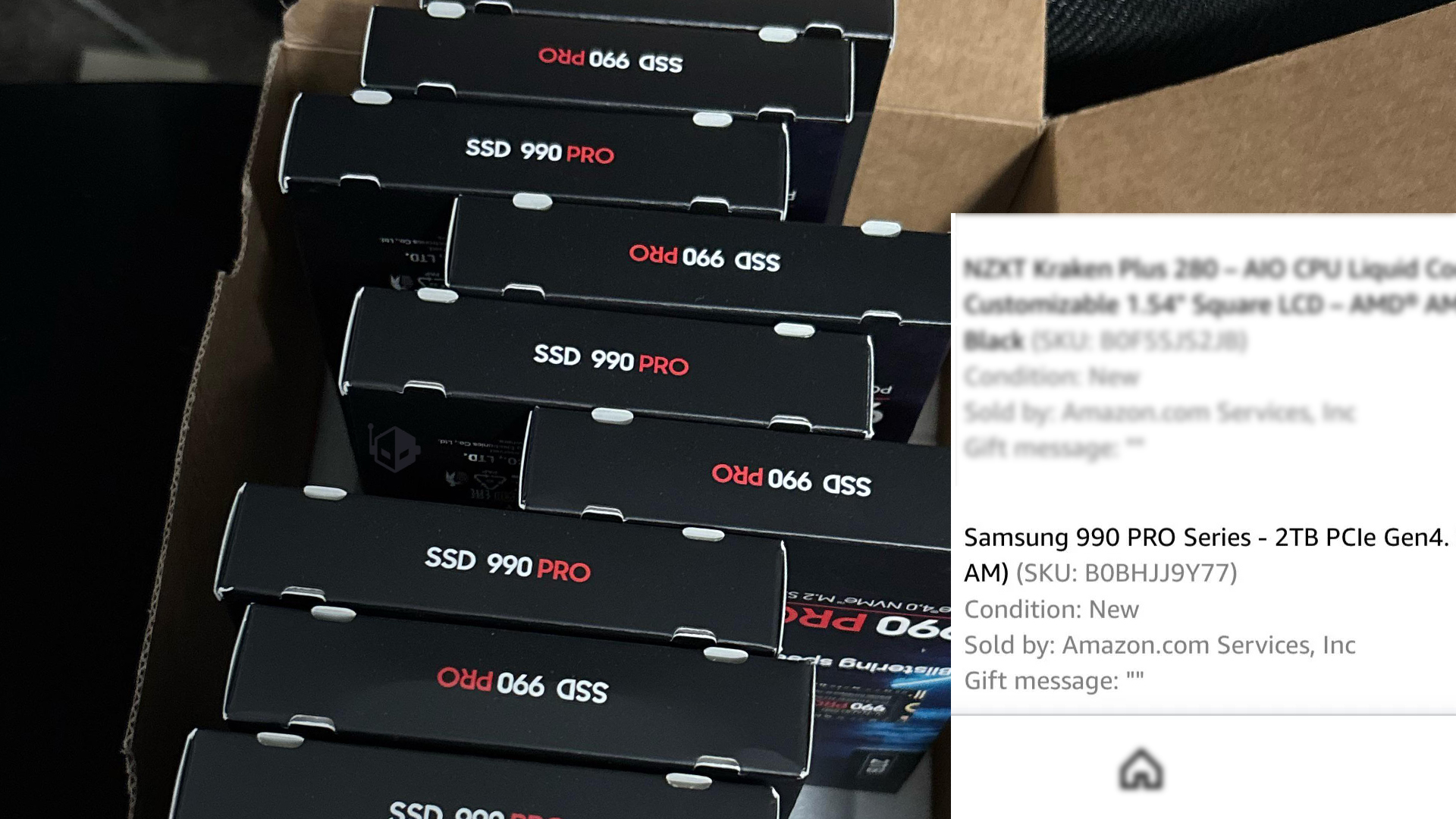 A stack of ten Samsung 990 PRO 2TB NVMe SSD boxes.