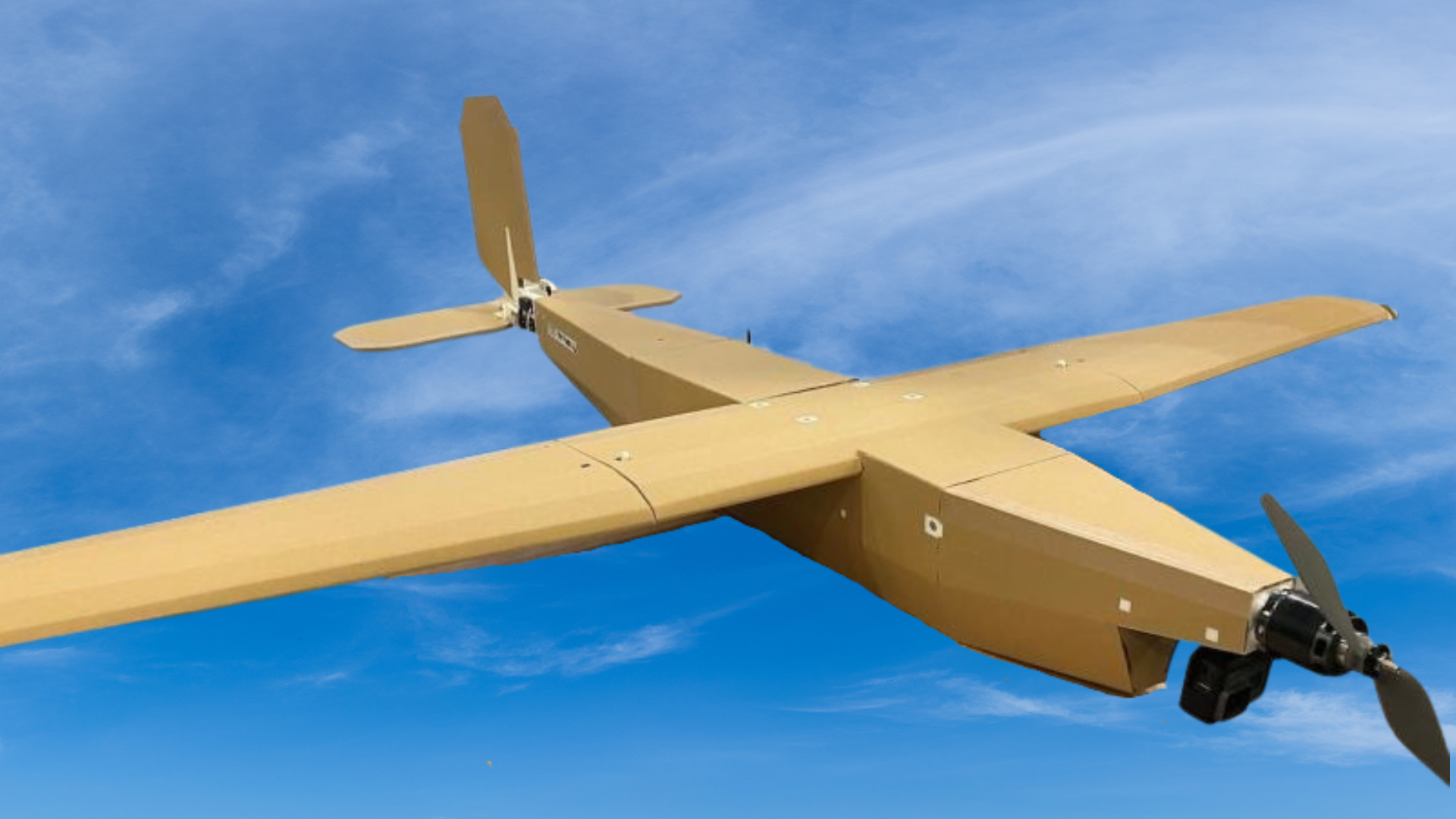 A close-up image of the AirKamuy 150 drone, showcasing its simple, cardboard construction.
