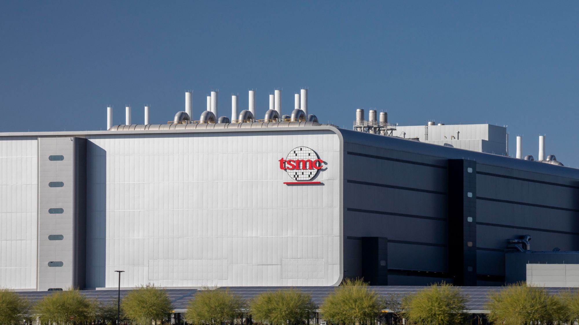 A TSMC fabrication plant with employees visible