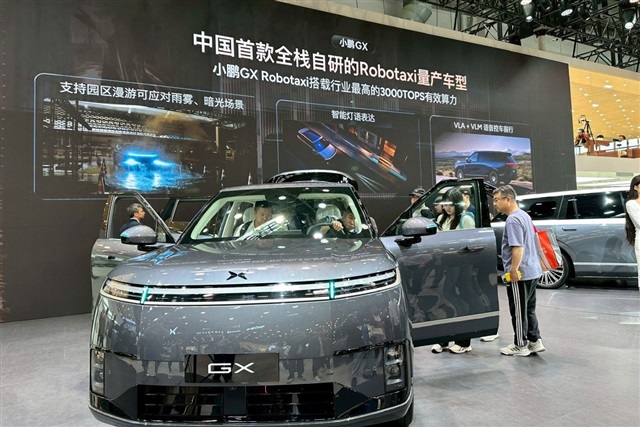 A futuristic concept car with glowing AI interface elements at the 2026 Beijing Auto Show.
