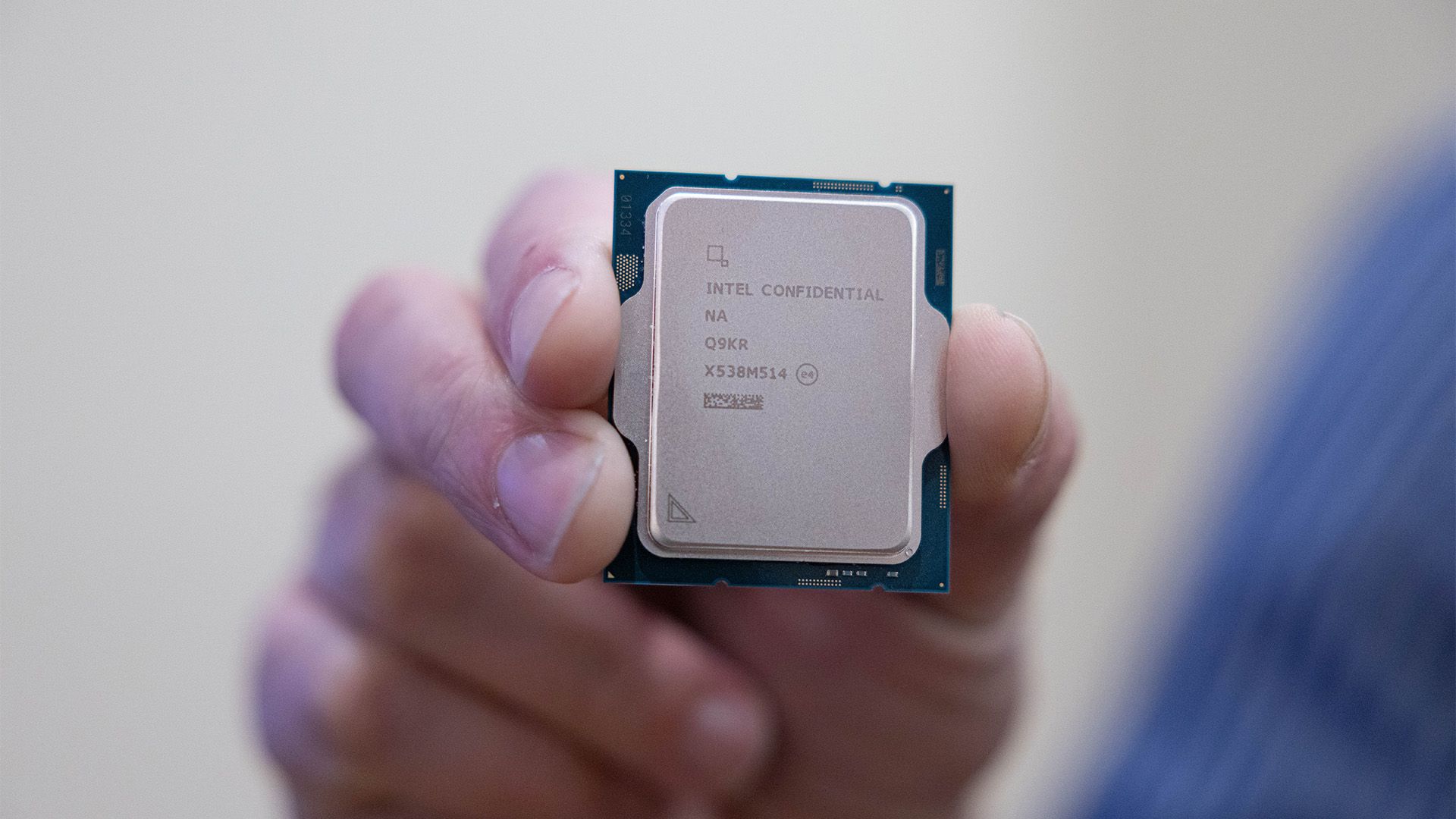 A close-up, somewhat cynical shot of an Intel CPU, perhaps with a slightly distorted or glitchy effect.