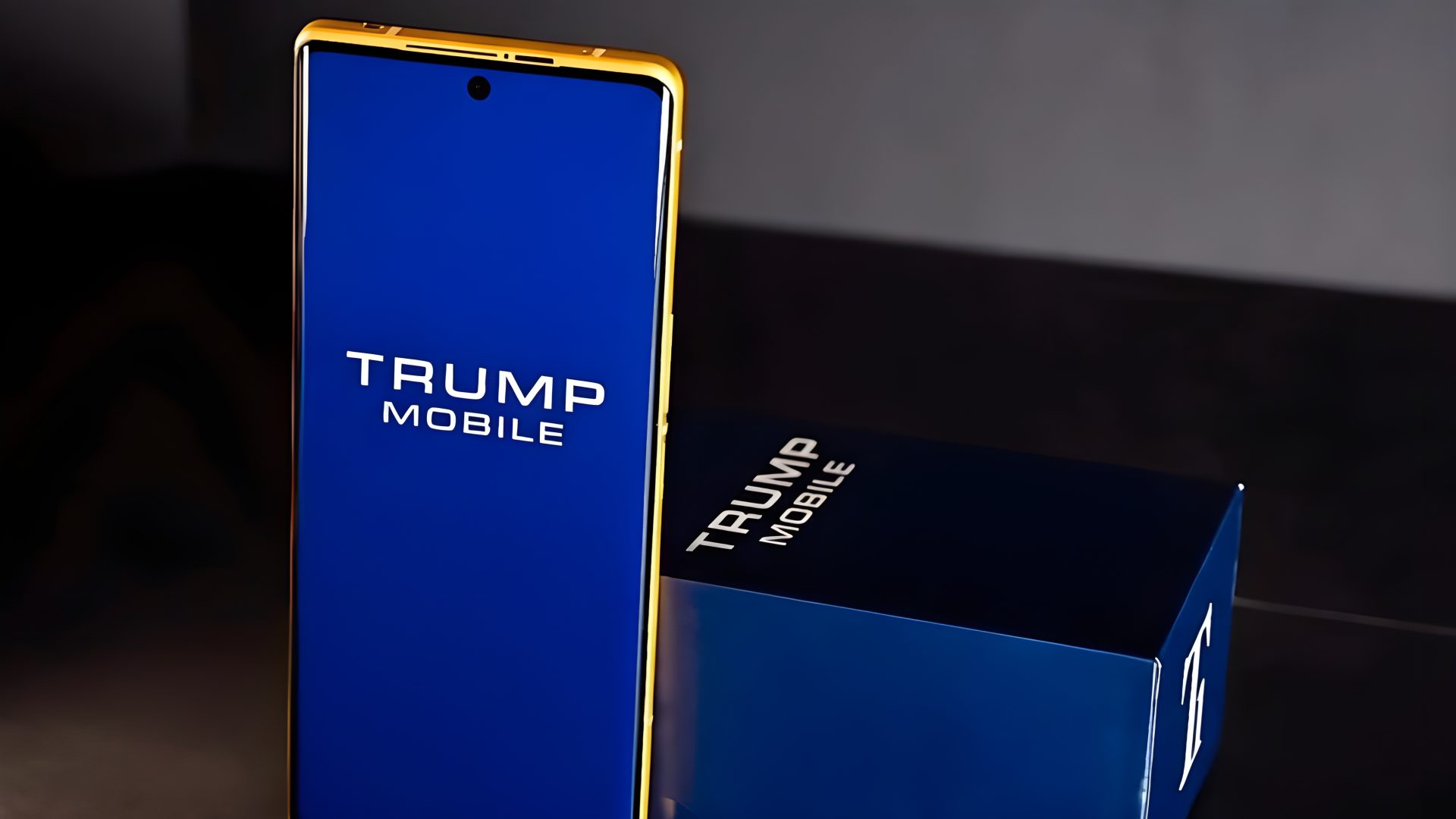 A close-up photo of the yellow Trump Mobile T1 phone, highlighting its design and branding.