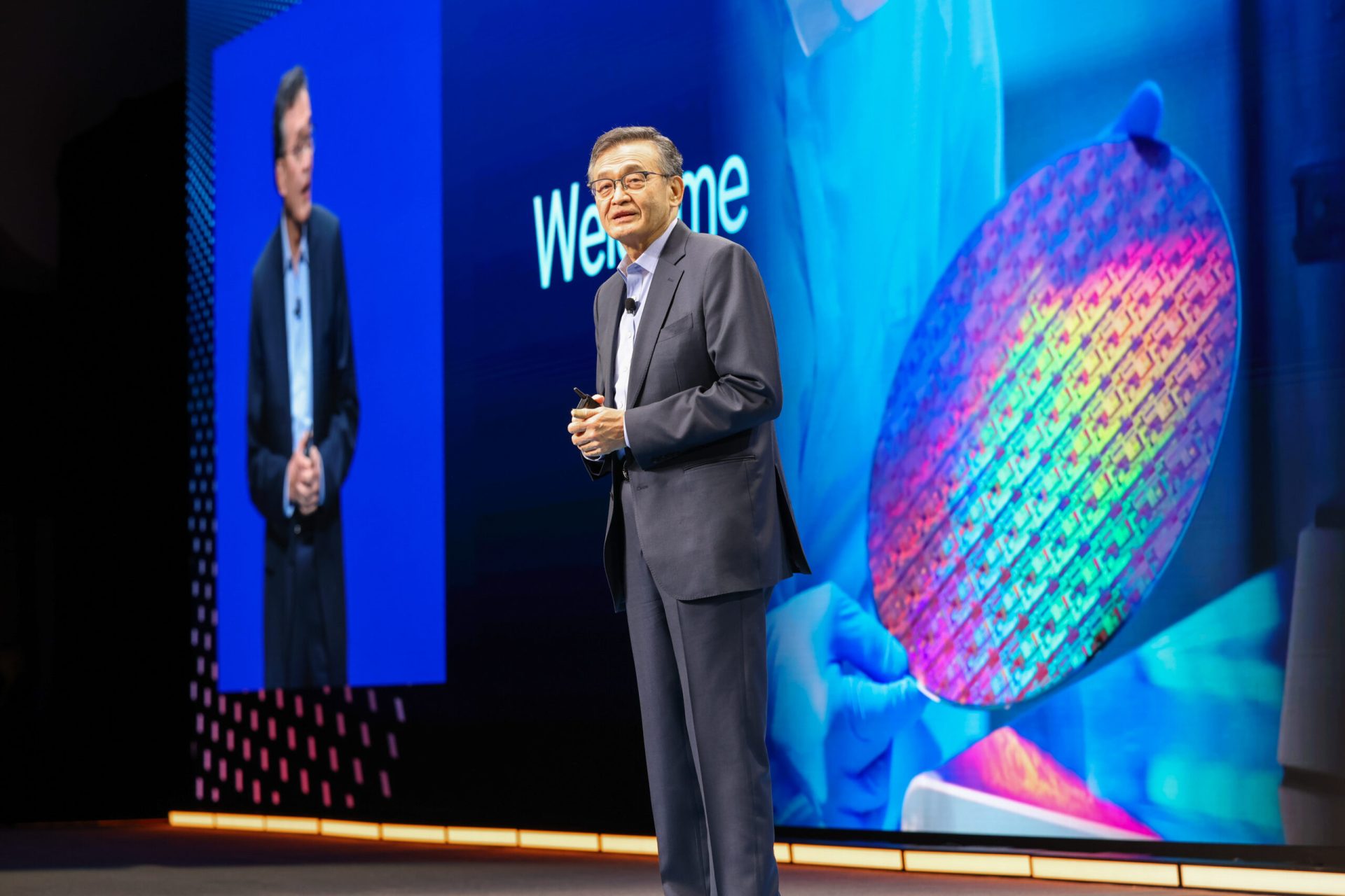 Intel CEO Lip-Bu Tan speaking at a podium.