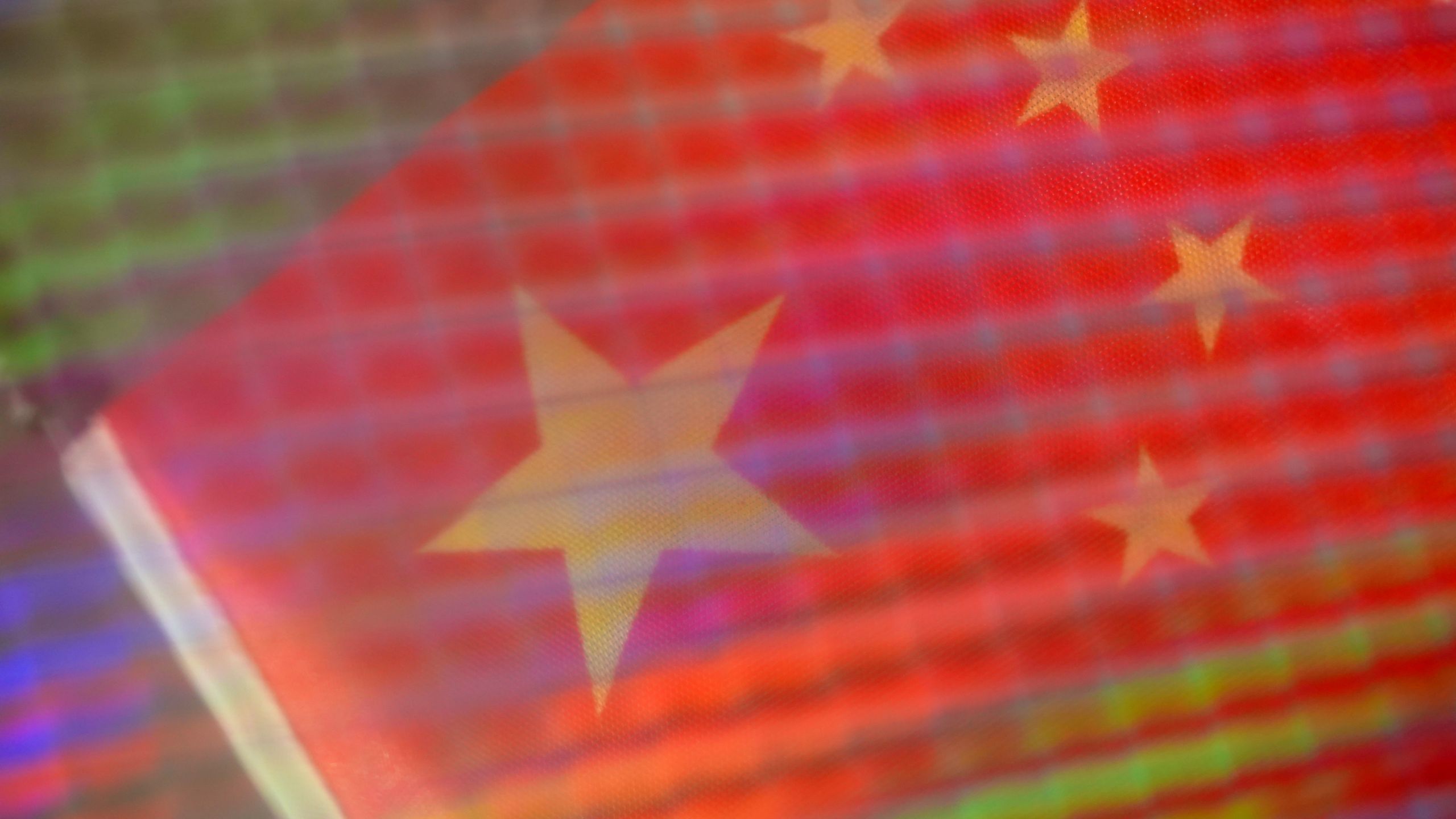 A close-up image of a complex computer chip with complex circuitry.
