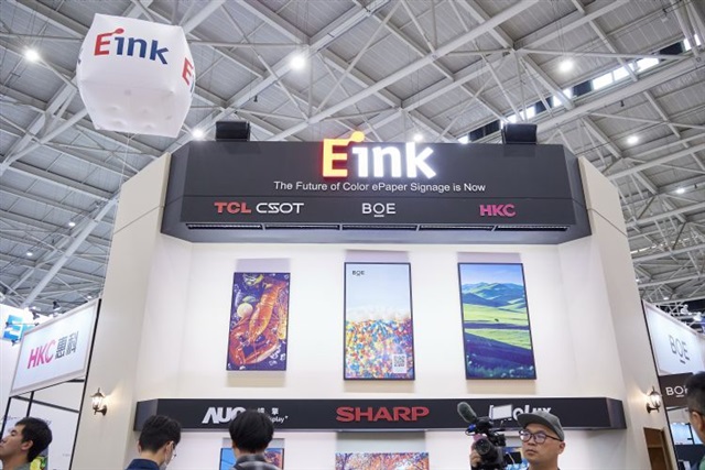 A close-up shot of a large, vibrant E Ink display showing a smooth, animated graphic.