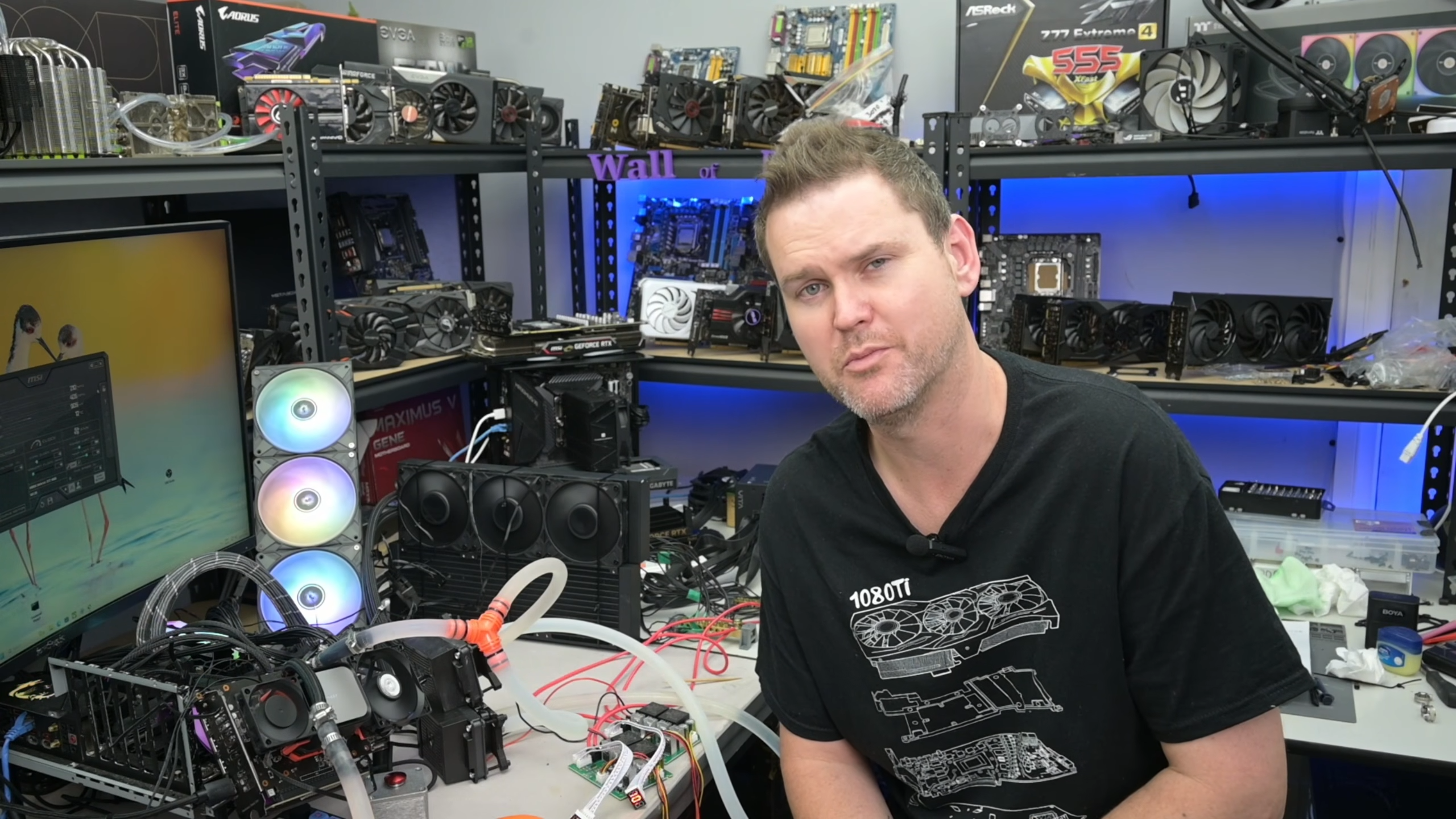 A complex, homemade Peltier thermoelectric cooling rig with dual 360mm AIO radiators and complex tubing connected to a graphics card.